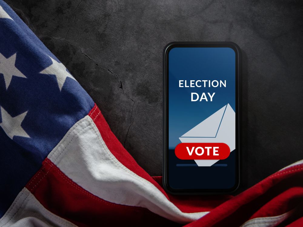 phone screen that says "Election Day Vote" next to American flag