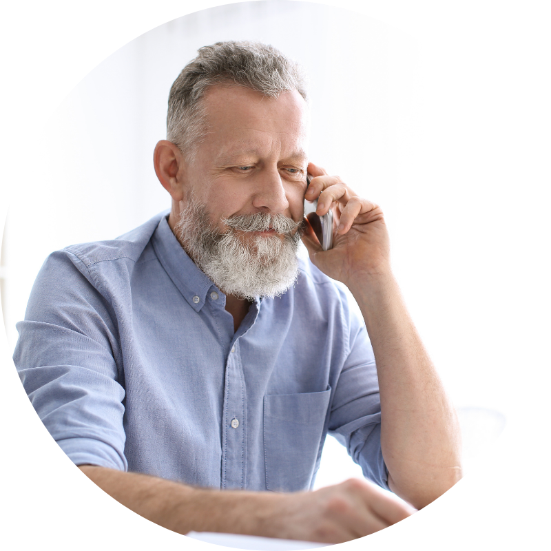 man in blue shirt voting in an election by telephone